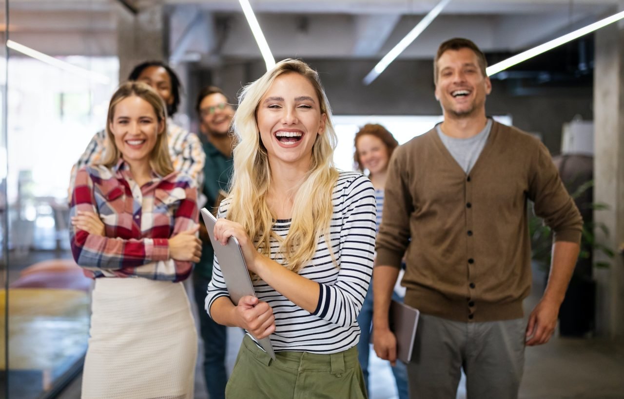 successful company with happy employees in modern office